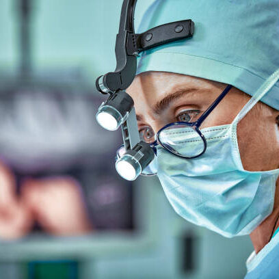 Female surgeon in operation room with reflection in glasses,