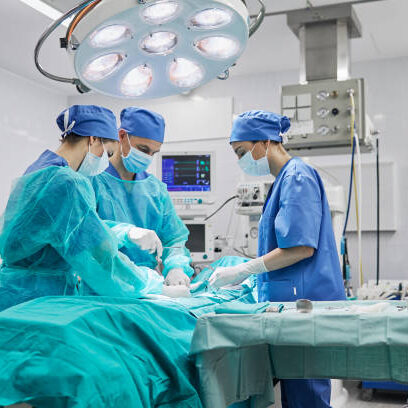 Team of surgeons in operating room at a hospital.